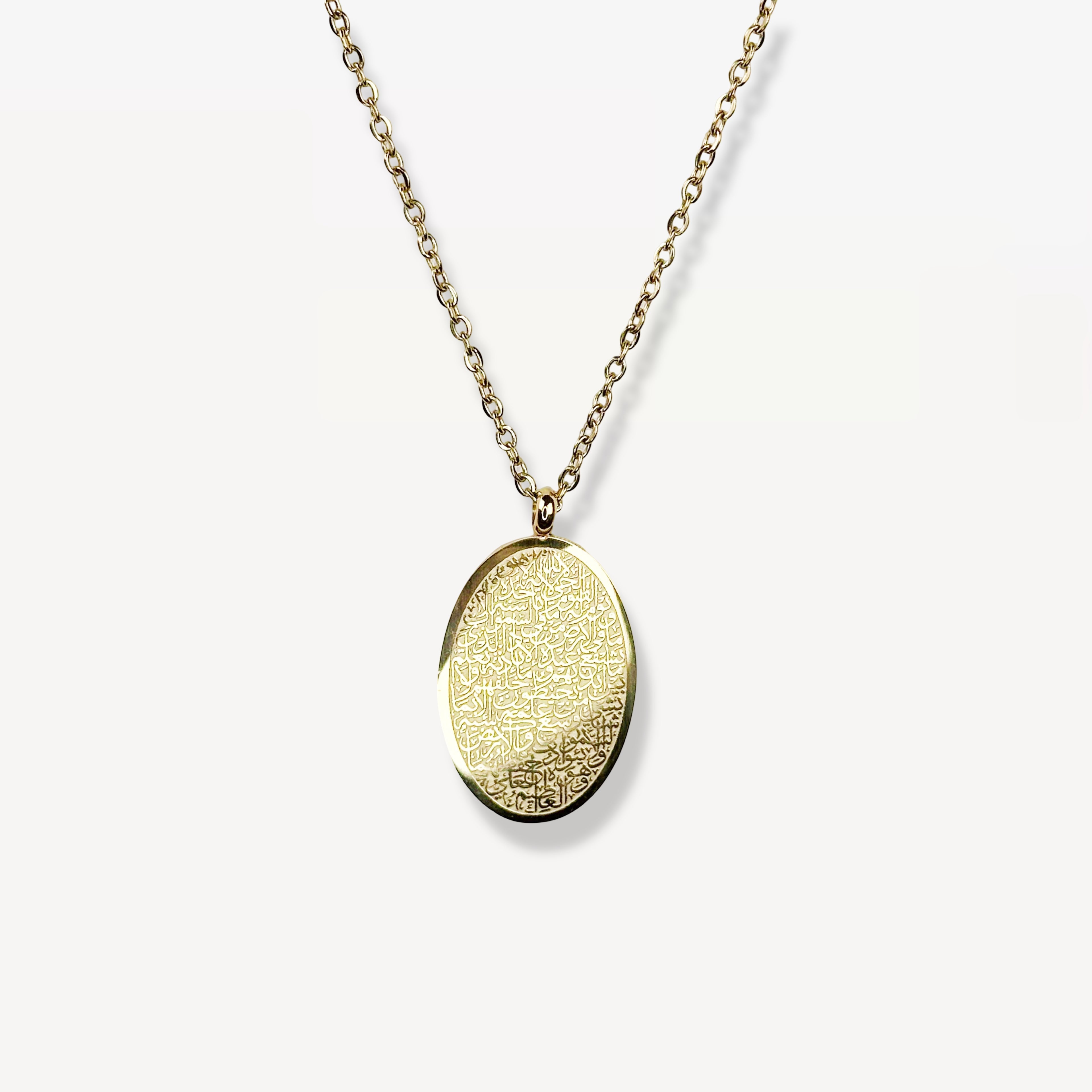 Cairo's ayatul kursi Gold necklace with an oval pendant on a white background